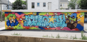 Image of public art installation Theory by artist Elie, located in Providence by the A to Z Liquors business on 319 Douglas Street, Provicence RI, joy, dialogue, The Avenue Concept